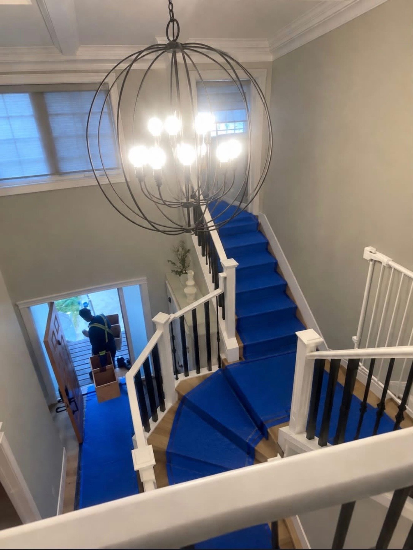 Protective runner laid over stairs during a Noah move